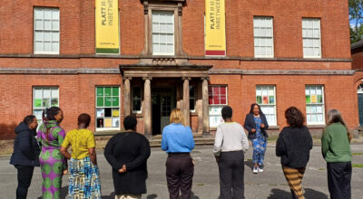 776 group members stood outside Platt Hall