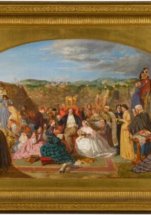 This image depicts a lively outdoor gathering or celebration, likely in a rural or mountainous setting judging by the distant landscape visible through the arched frame. The central focus is a large group of people dressed in elaborate period costumes, suggesting a scene from the past, perhaps the 18th or 19th century. The colorful attire, varied poses, and animated expressions convey a festive and joyous atmosphere. The ornate golden frame enclosing the painting adds an air of grandeur and artistic significance to the depicted scene.