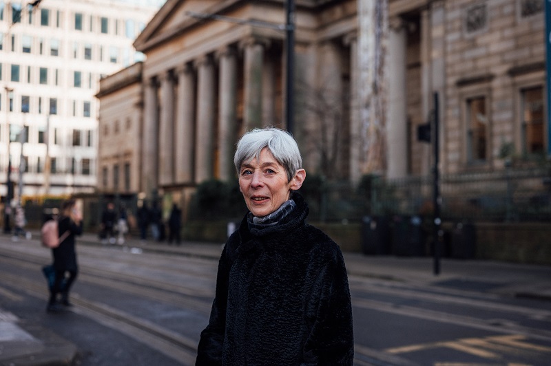 Portrait of Janet standing outside the gallery