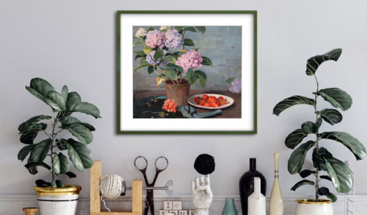 A home interior - a floral still life framed painting hangs above a styled cabinet covered in plants and accessories